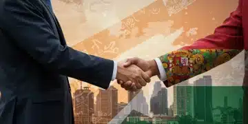 Ejecutivo español y africano estrechando manos, representando colaboración empresarial en África Subsahariana.