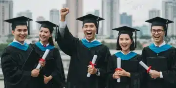 Graduates celebrating with financial charts in background, symbolizing career and salary growth