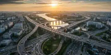 Modern city skyline with new bridges and highways under construction, symbolizing infrastructure development.