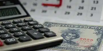 Social Security card and calculator with 2025 calendar indicating future benefit adjustments.